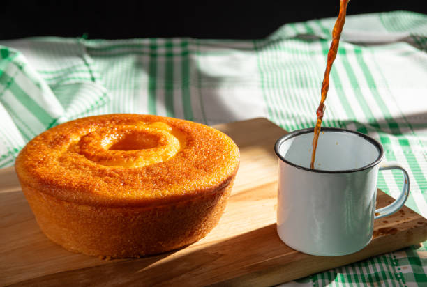 istock Orange cake, a beautiful sunny breakfast table and delicious Orange cake, selective focus. 2185995867