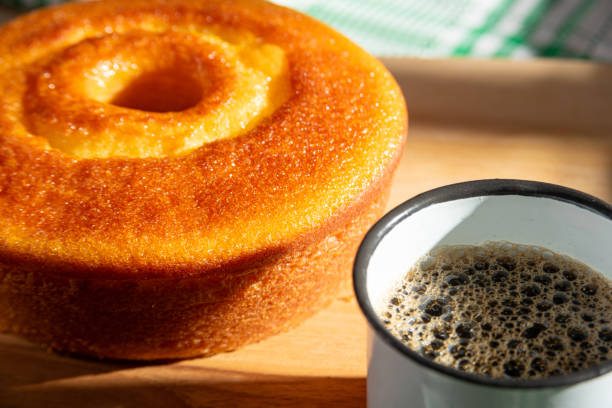 istock Orange cake, a beautiful sunny breakfast table and delicious Orange cake, selective focus. 2185995994