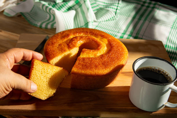 istock Orange cake, a beautiful sunny breakfast table and delicious Orange cake, selective focus. 2185996165