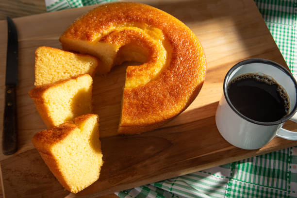 istock Orange cake, a beautiful sunny breakfast table and delicious Orange cake, top view. 2185996323