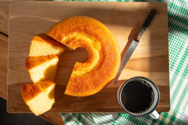 istock Orange cake, a beautiful sunny breakfast table and delicious Orange cake, top view. 2185996420