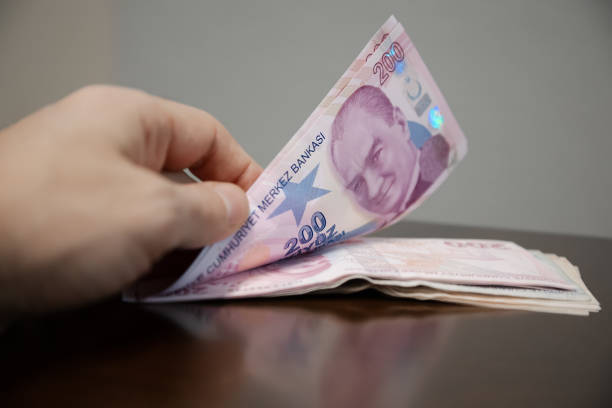 istock Hands holding Turkish Lira Banknotes , stock photo 2185996972