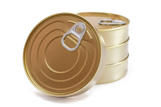 A Group of Stacked Tin Cans with Blank Edges Isolated on White Background. Canned Food. Different Aluminum Cans for Safe and Long Term Storage of Food. Steel Sealed Food Storage Containers - Isolation