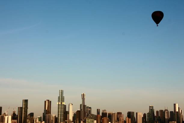 istock Black hot air balloon above Melbourne skyline 2186005096