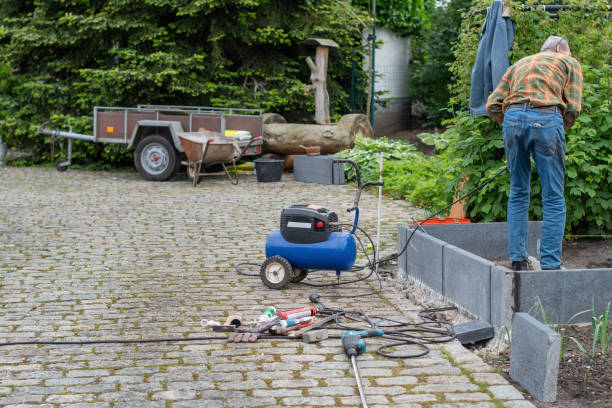 istock Middle aged man using various tools to build a greenhouse in his garden, home eco vegetable growing concept 2186016137