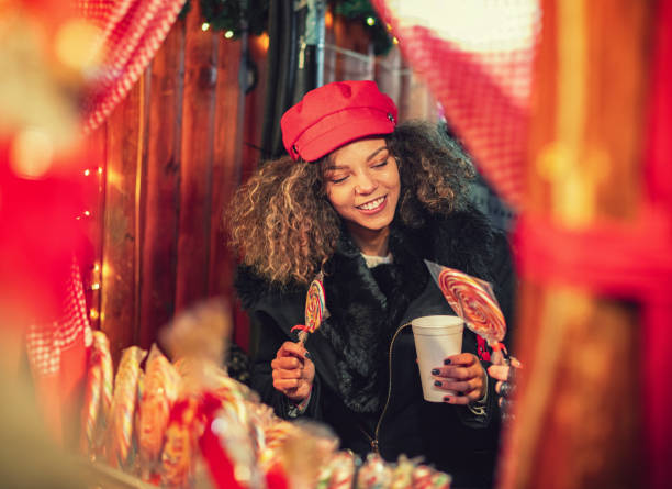 Young beautiful women having fun while shopping together presents for the Christmas