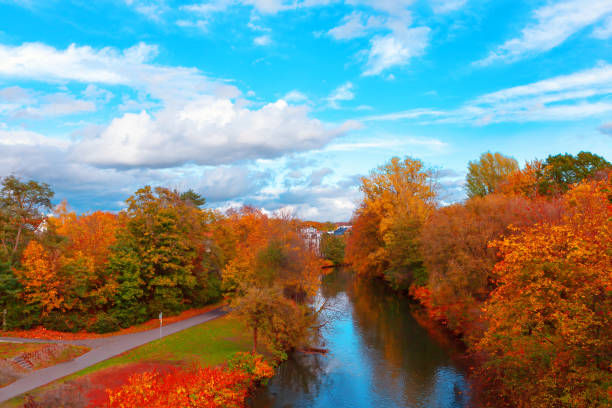 istock Serene autumn landscape with a river flowing through the center 2186021347