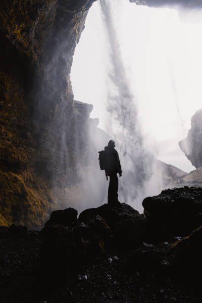 istock Hiker exploring majestic waterfall in iceland's dramatic landscape 2186024723
