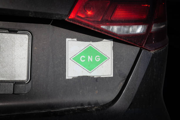 istock Sign indicates that a car is using Compressed Natural Gas (CNG) as fuel emphasizing the use of CNG as an alternative fuel for vehicles, highlighting environmental considerations and energy choices. 2186025464