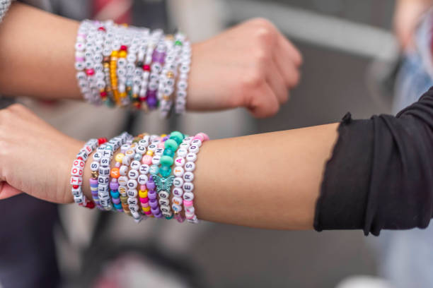 Toronto Ontario, Canada- November 21st, 2024: Swifties showing off their bracelets before going into the Rogers Centre in downtown Toronto for Taylor Swift's fourth concert at the Rogers Centre.