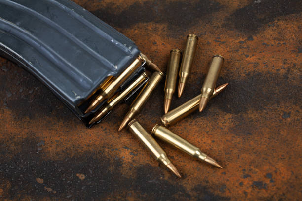 istock Ammunition with magazine on rusty metal 2186032706