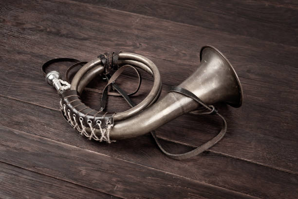 istock Hunting horn on rustic wood plank. 2186032759