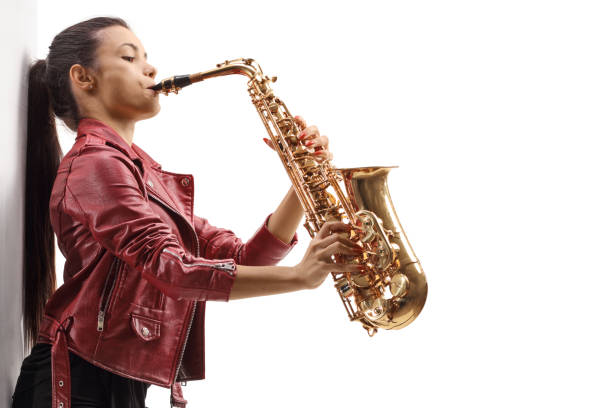 istock Young female in a leather jacket playing a saxophone 2186039136