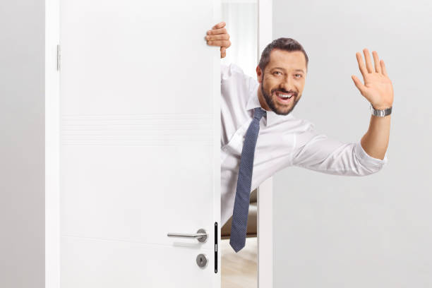 istock Cheerful man opening a door 2186039147