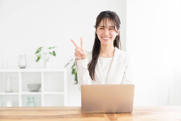 istock young asian businesswoman using laptop 2186045108