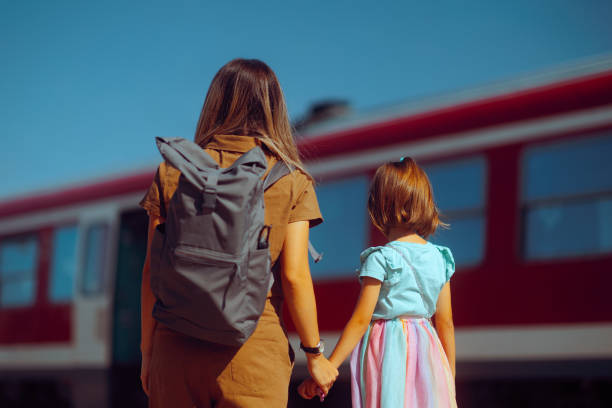 Mother and Daughter Waiting for the Train to Arrive