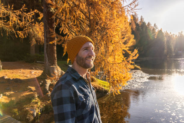 istock Smiling Man in Autumn by a Lake 2186051651