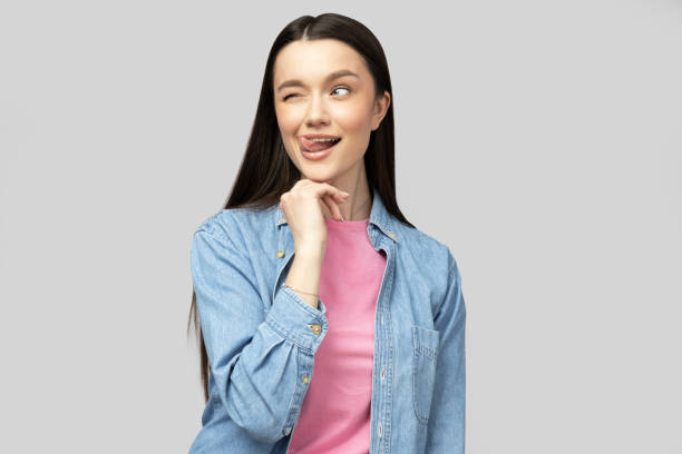 istock Attractive young brunette posing on a gray background 2186057524