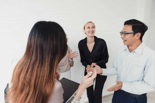istock Group of professionals engaging in lively discussion during a meeting in a modern office space 2186062212