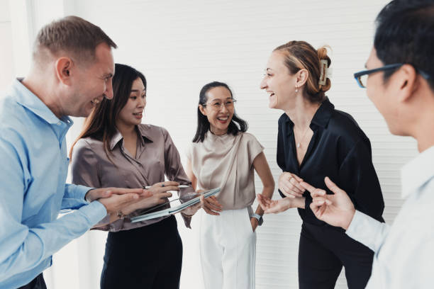 istock Team celebration in a modern office setting showcasing collaboration and joy during a brainstorming session 2186062636