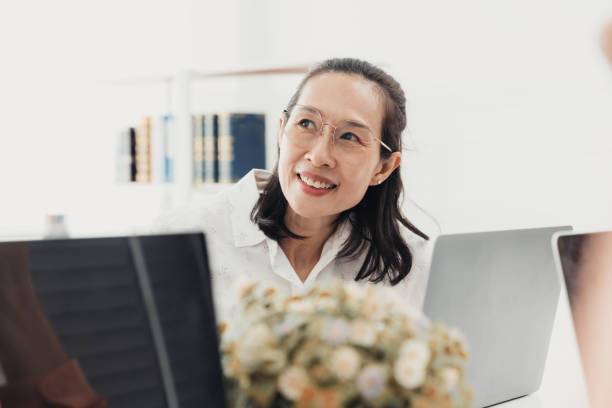 istock Professional woman engaged in a collaborative discussion during a meeting in a modern office environment 2186064614