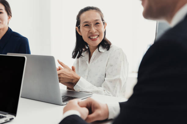 Business meeting highlights collaboration and communication among diverse professionals