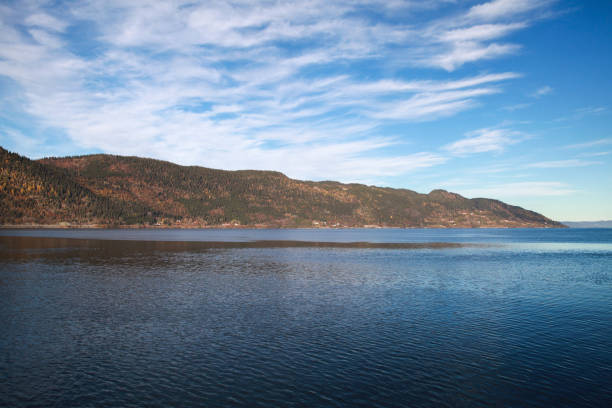 istock Norwegian landscape. Coastal mountains covered with forest 2186064976