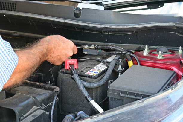 istock Tightening up a terminal on a car battery 2186082512