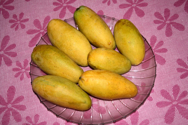 istock Dasheri mango, cultivar of mango (Mangifera indica), on display. 2186088234