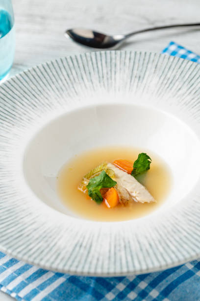 istock Fish soup with vegetables on white wooden table 2186088418