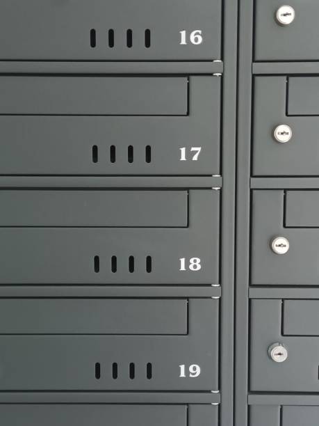 istock Close-up of gray mailboxes with white numbers 2186090072