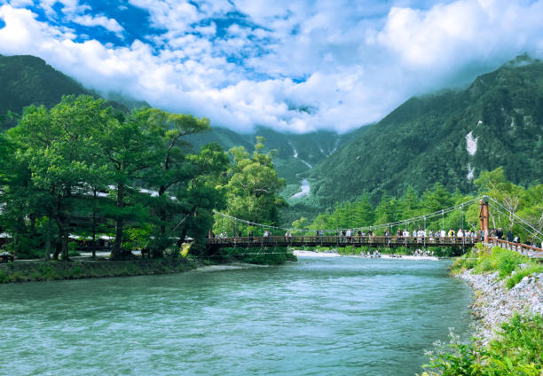 beautiful view of clear river and green mountains as a backdrop.