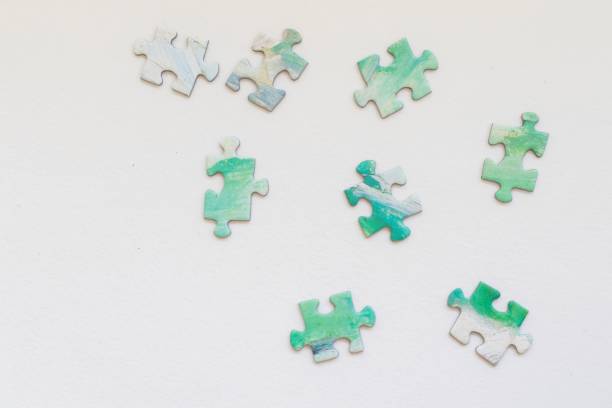 istock Colorful jigsaw puzzle pieces arranged on a white background 2186102601