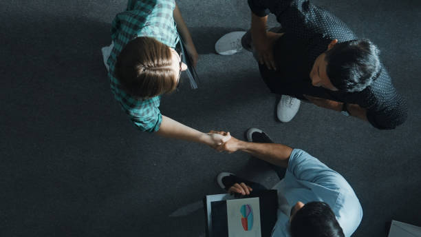 istock Investor listening team and making agreement while hand shaking. Convocation. 2186104849
