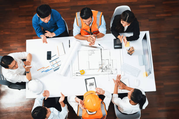 istock Diverse group of civil engineer and client working on architect. Prudent 2186106053