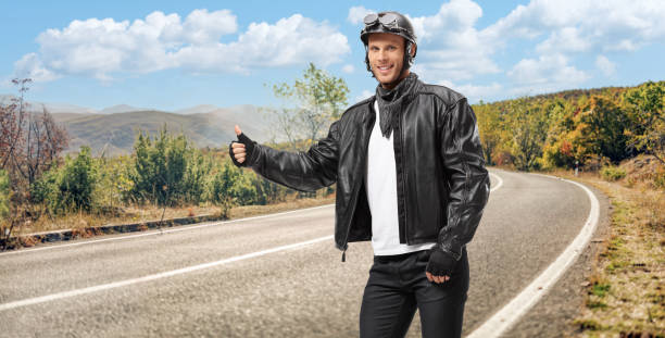 Belgrade, Serbia - October 10, 2024: Motorcyclist speeding on a motorbike on a sunny day, close up