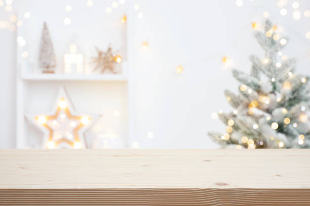 istock Wood table background with blurred Christmas tree for product display montage 2186109402