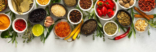 istock Assorted cooking spices and herbs arranged on a gray surface, featuring natural tones that add depth and aroma to any meal, banner 2186115765