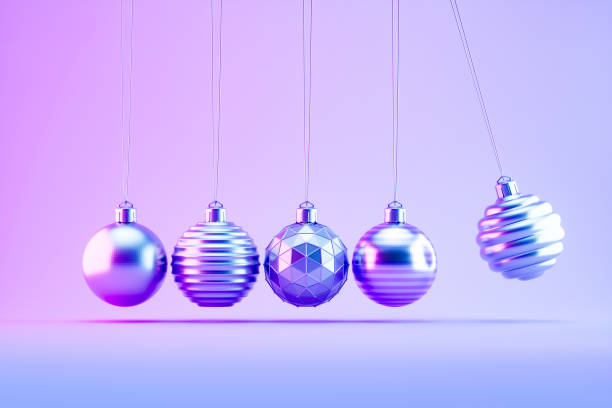 istock Christmas Ornaments on Neon Lighting Background with Newton's Cradle Style 2186115939