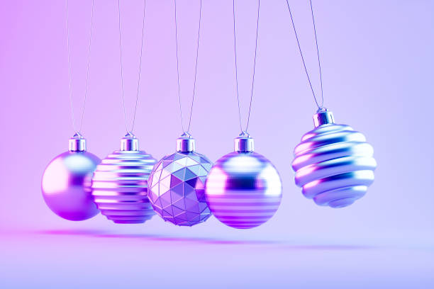 istock Christmas Ornaments on Neon Lighting Background with Newton's Cradle Style 2186116002