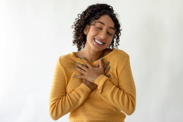 istock Beautiful woman smiling with eyes closed 2186116924