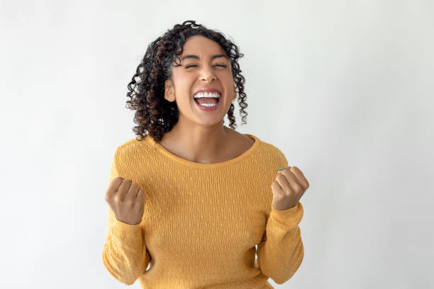 Happy woman is excited and celebrating victory