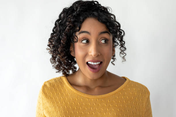 istock Young woman looking away with open eyes 2186118346