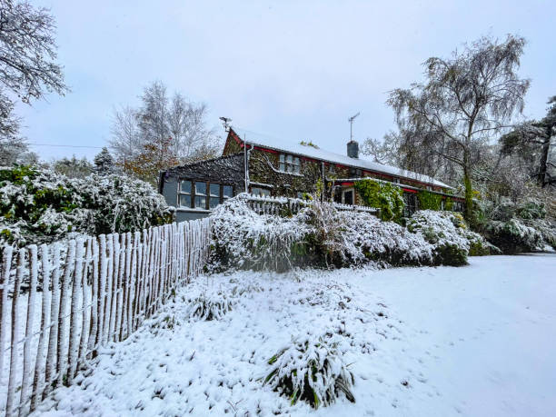 istock Farm Cottage in Winter Snow 2186119635