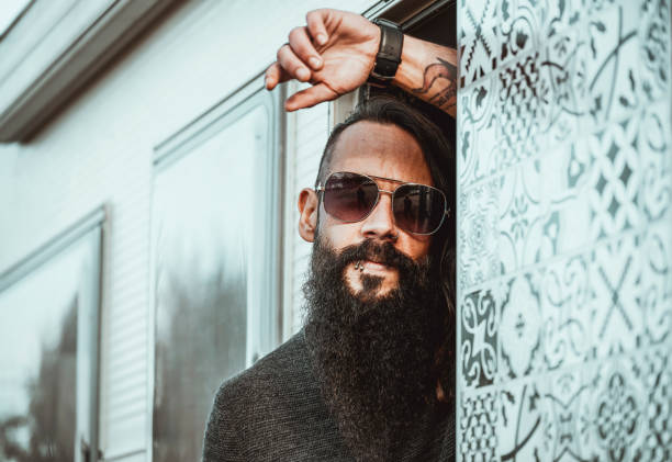 Close-up portrait of Brazilian guy with sunglasses outdoors