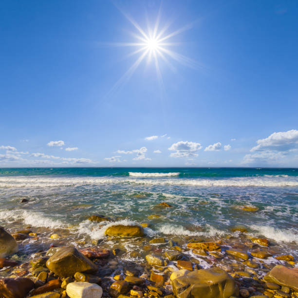 emerald sea bay with stony coast at the sunny day