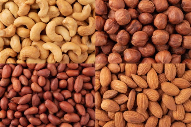 istock Top view of many different nuts close up. Cashews, hazelnuts, peanuts 2186126785