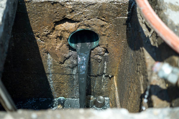 istock Industrial sewage water draining out from cement drain pipe into the drainage pipe.Environmental pollution scene photo. 2186127498