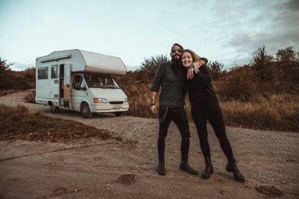 istock Mixed ethnical race couple standing at their mobile home 2186127718