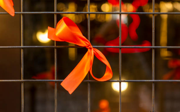 istock A lattice decorated with a red bow outdoors. New-year 2186129859